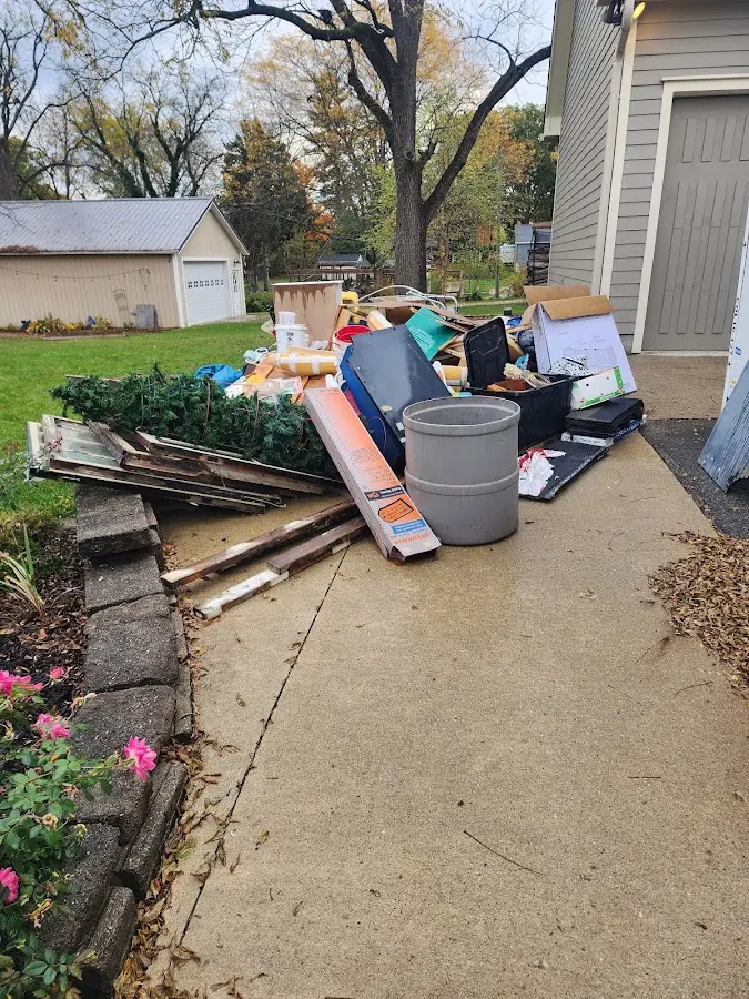 Dumpster being loaded with debris for 30 Yard Dumpster Rental in Heron Bay